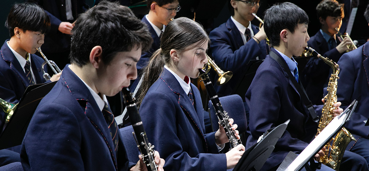 seven students playing instruments